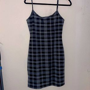 i am selling this black and gray dress. It has never been worn before